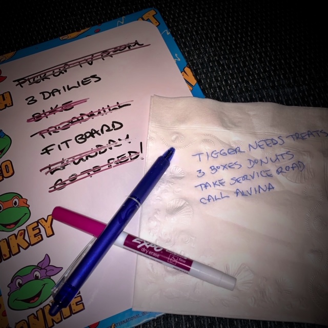 A cheap whiteboard and a list on a napkin A cheap whiteboard and a list on a napkin.